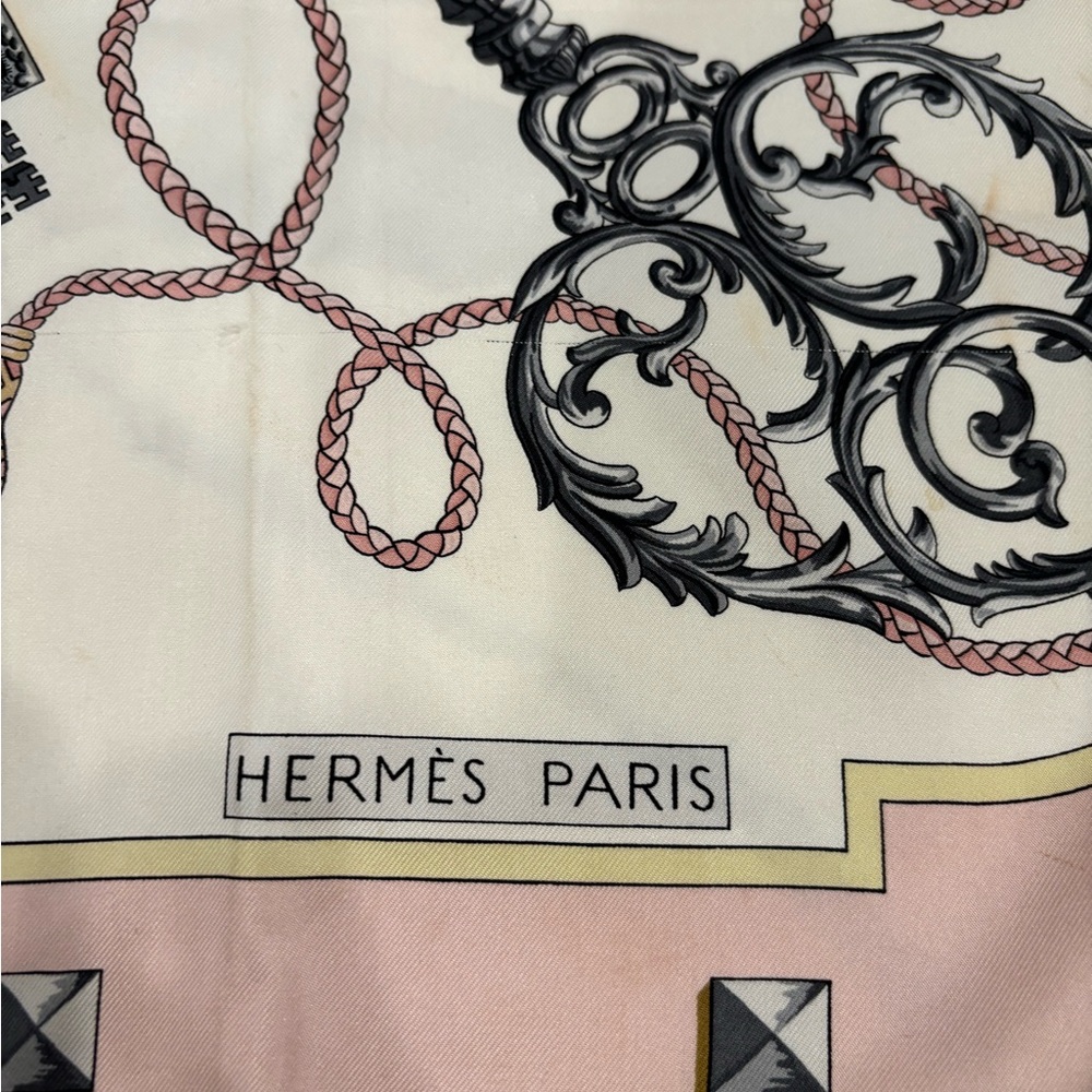 HERMES
Les Cles pink silk scarf